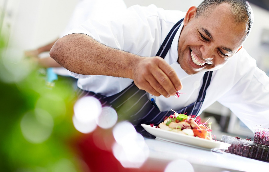 Professional catering chef preparing food for an event